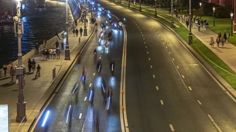 Night race of cyclists through the Central streets of the city,time lapse Stock Footage 138775165