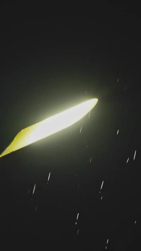Night rain in the light of a lantern Stock Footage 335278189