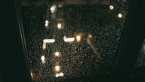 Night rain outside the window with rain drops roll on the glass Video stock 73900740