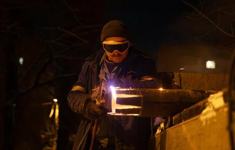 Night Repair Welding Work on a Heating Line in Kyiv Stock Photos