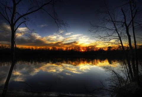 Night river with sunset reflection Stock Photos