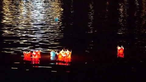 Night river view with floating lanterns and boats Stock Footage 83227676