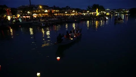 Night river view with floating lanterns and boats. Hoi An, Vietnam 4K Stock Footage 132182268