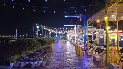 Night riverside promenade rectangular light frames, hanging lanterns — Da Nang 库存影片 347670508