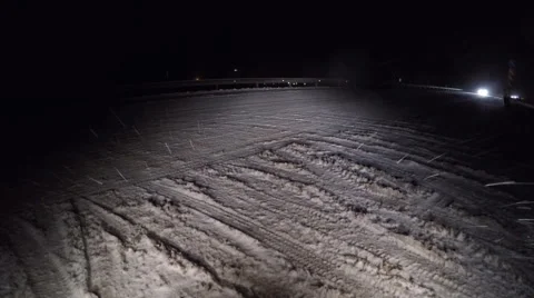 Night road with strong blizzard in moving car headlight. Stock Footage 58636602