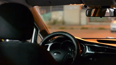 Night road. View from inside car. Natural light. Street and other cars is motion Stock Footage 147057069