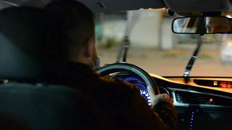 Night road. View from inside car. Natural light. Street and other cars is motion Stock Footage 147057193