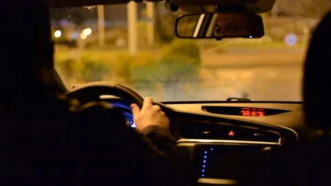 Night road. View from inside car. Natural light. Street and other cars is motion Stock Footage 147057343