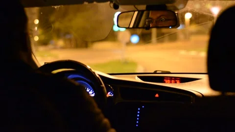 Night road. View from inside car. Natural light. Street and other cars is motion Stock Footage 147057399