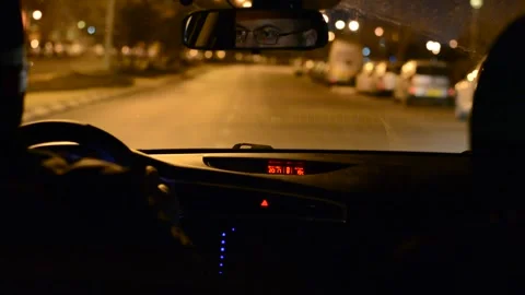 Night road. View from inside car. Natural light. Street and other cars is motion Stock Footage 147057421