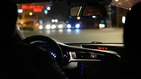 Night road. View from inside car. Natural light. Street and other cars is motion Stockbeeldmateriaal 147057427