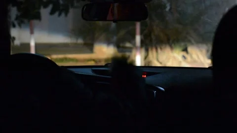 Night road. View from inside car. Natural light. Street and other cars is motion Stockbeeldmateriaal 147057453