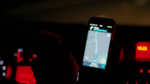 Night rough riding car, defocused navigation in mobile phone Stock Footage 146731191