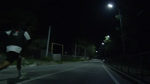 Night Run — Young Athlete on Empty Street Stock Footage 314644265