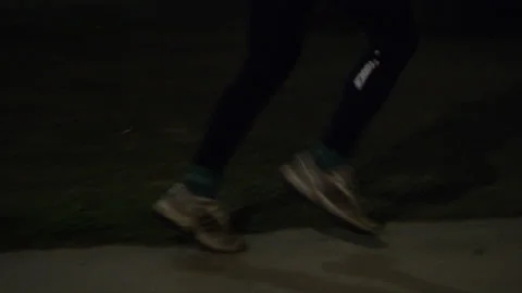 Night runner on a city streets Stock Footage 137364623