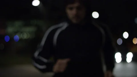 Night runner on a city streets Stock Footage 137533610