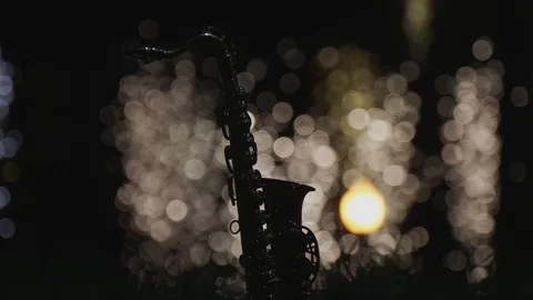 Night saxophone and light reflection in water Stock Footage 95369637