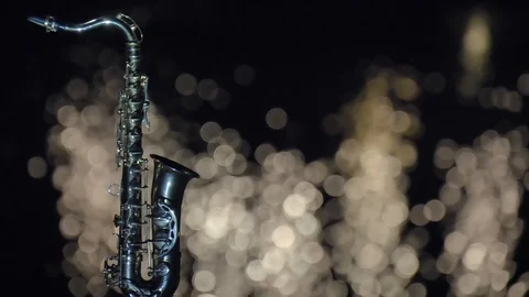 Night saxophone and light reflection in water Stock Footage 95437925