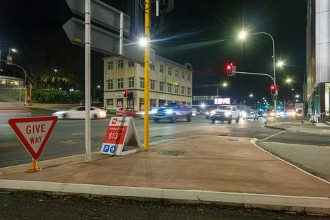 Night scene and light streams of cars passing in downtown Auckland on inter.. Stock Photos