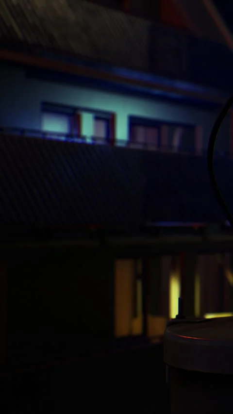 Night scene with buildings reflecting light in an urban setting Stock Footage 334184626