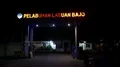 Night scene illuminated entry sign Labuan Bajo harbor in Flores, Indonesia 4k or 4k+ Resolution