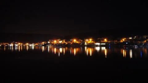 Night scene with light and reflection at Balikliova, Urla, izmir, Turkey. Stock Photos