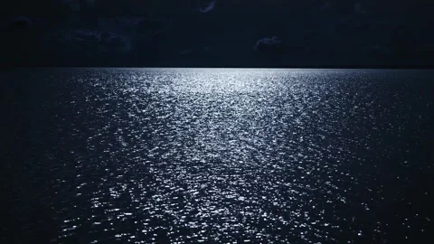 Night scene. The moon is reflected in the water, the moon path on the surface of Stock Footage 243409454