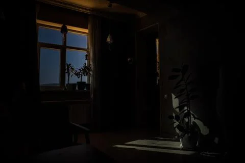 Night scene of moon seen through the window from dark room. Moonlight inside  Stock Photos