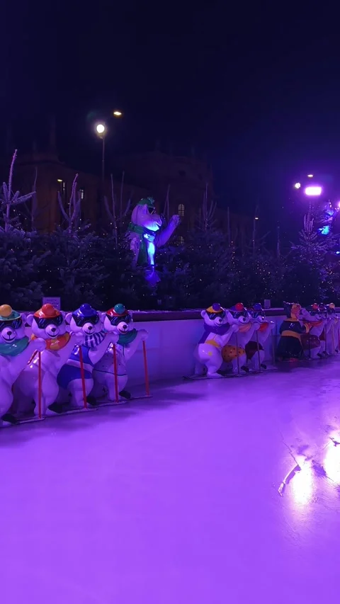 Night scene at the Münchner Eiszauber ice rink in the center Stock Footage 323521324