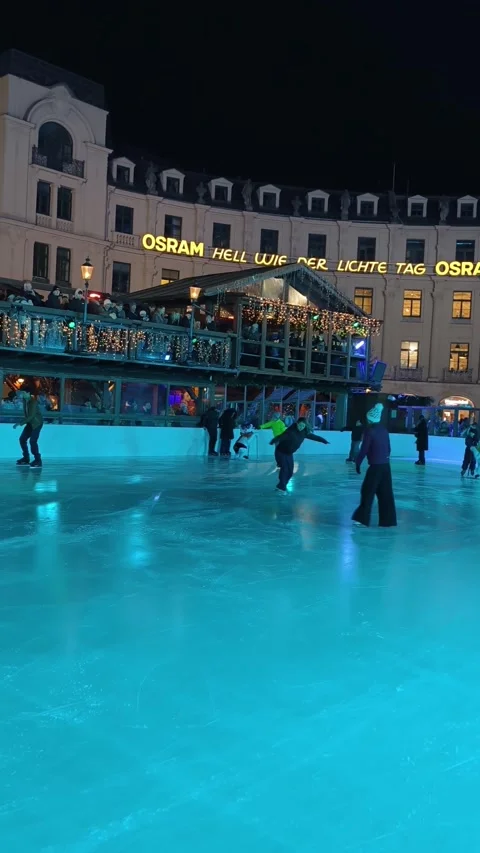 Night scene at the Münchner Eiszauber ice rink in the center Stock Footage 323521520