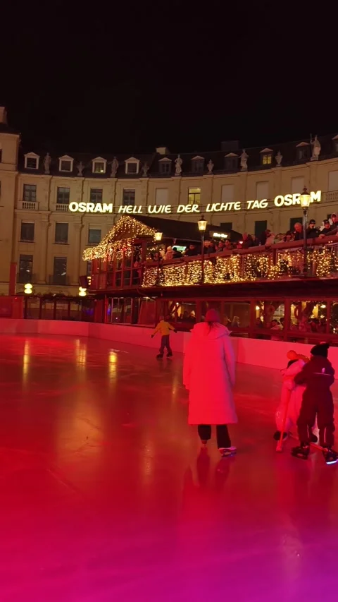 Night scene at the Münchner Eiszauber ice rink in the center Stock Footage 323521855