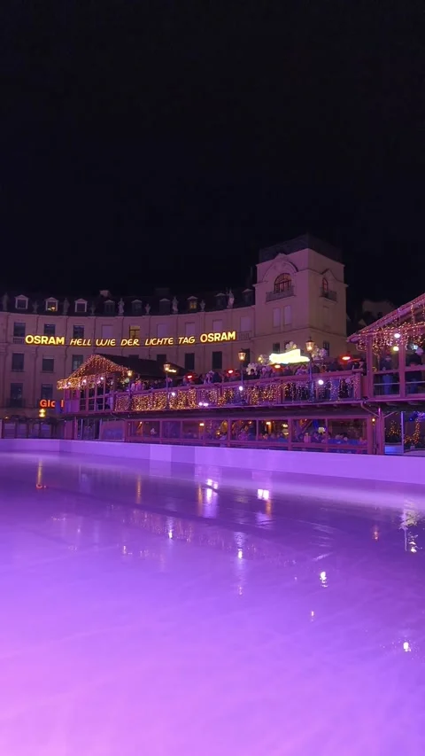 Night scene at the Münchner Eiszauber ice rink in the center Stock Footage 323522805