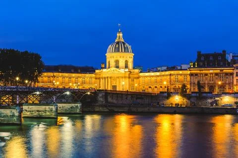 Night scene of National Residence of the Invalids and the pont des arts Stock Photos