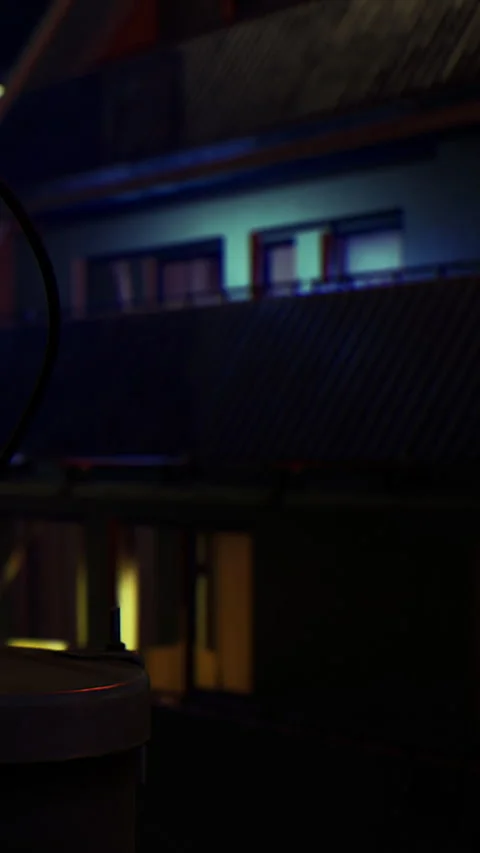 Night scene showing building windows with light in urban setting Stock Footage 336578538