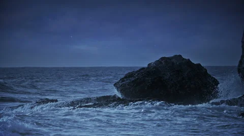 Night sea view with waves crashing at rocks. Stock Footage 58748183