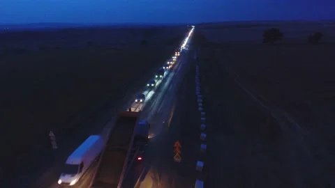 Night shift work .48 hours. Asphalt paver, roller and truck at the repair site Stock Footage 231653964