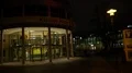 Night shot city street scenery illuminated modern theater building 4k or 4k+ Resolution