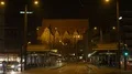 Night shot city street scenery with tram station and church building 4k or 4k+ Resolution