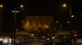 Night shot city street scenery with tram station and church building 4k or 4k+ Resolution