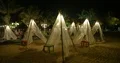 Night shot decorative white beach tents with lighting in Bali 4k or 4k+ Resolution