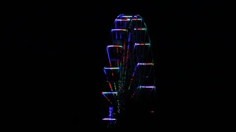 Night shot of Ferris wheel static lights flashing Stock Footage 93918387