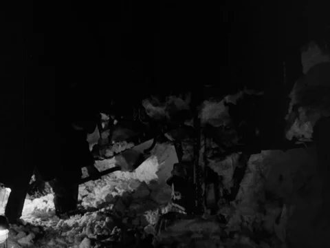 Night shot of freight train rescue from snow drift, men with shovels, UK 1955 스톡 동영상 133270699