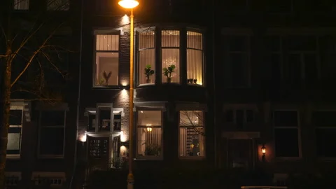 Night shot of house in upper class neighborhood, as seen from street. Amsterdam. Video stock 148271050