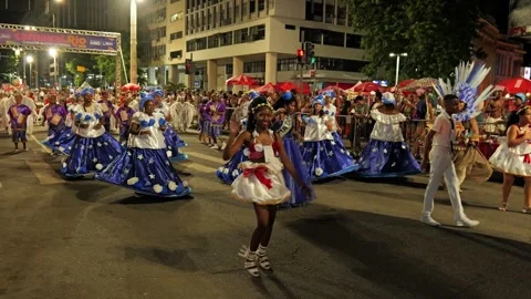 Night shot of performers dancing samba in costume during a Rio de Janeiro Stock Footage 336098633