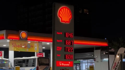 Night shot of Shell gas station showing fuel prices in Valdivia Chile with Stock Footage 336639384