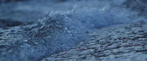 Night shot of small wave crushing in slowmotion Stockbeeldmateriaal 97901466