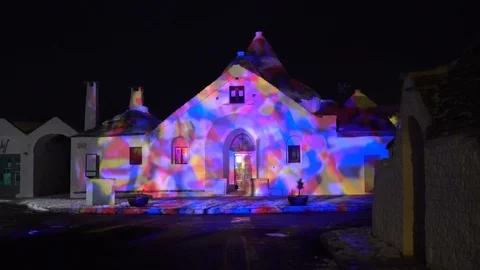 Night shot of Trullo Sovrano in Alberobello Italy during christmas time Stock Footage 89779205
