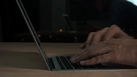 Night shot Typing on computer notebook on the bed at night Video stock 94869826