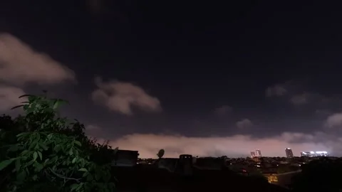 Night Sky And Clouds Over The City Time Lapse Background Stock Footage 339966634