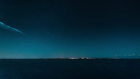 Night Sky and Distant City Lights Over Oresund, Sweden Stock Footage 342513917